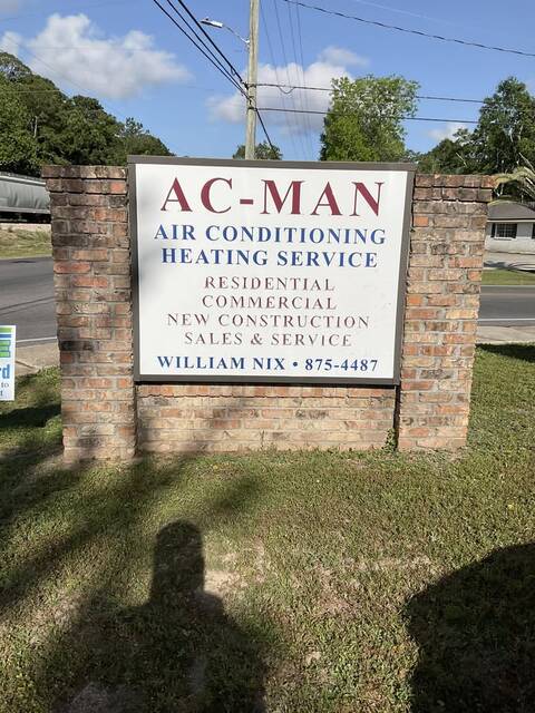 The AC-MAN roadside sign on Government Street with William Nix and 875-4487 on it